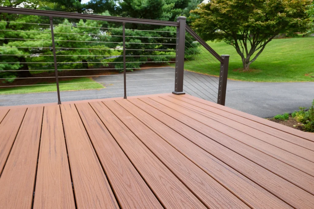 Builder installing boards shows the about us process of Deck Builders Palmerston North.